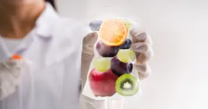 Medical professional holding a nutrient IV bag symbolizing IV Nutrient Supplements in Spicer, MN